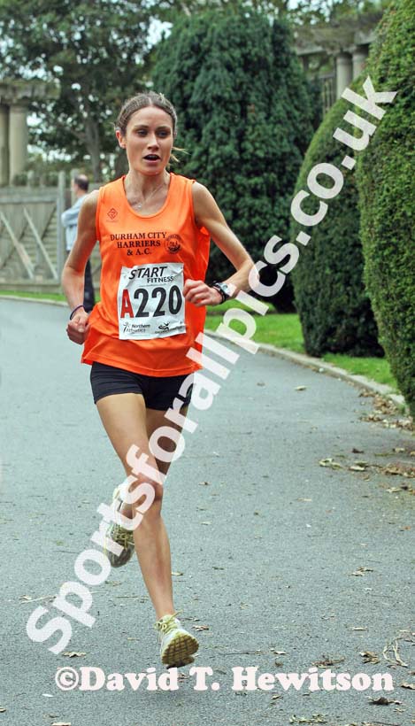 Running the first leg Rosie Smith (Durham City) leads the Northern Womens 4 Stage Road Relay.